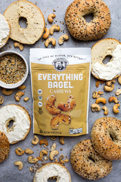 Bagel Cashews packaging with sliced bagels and cashews on a gray surface