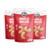 Three packages of Maple Bacon Cashews on a white background