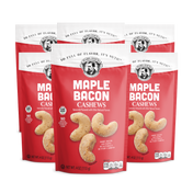 Three packages of Maple Bacon Cashews on a white background