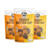Three packages of Peanut Butter Cup flavored peanuts on a white background