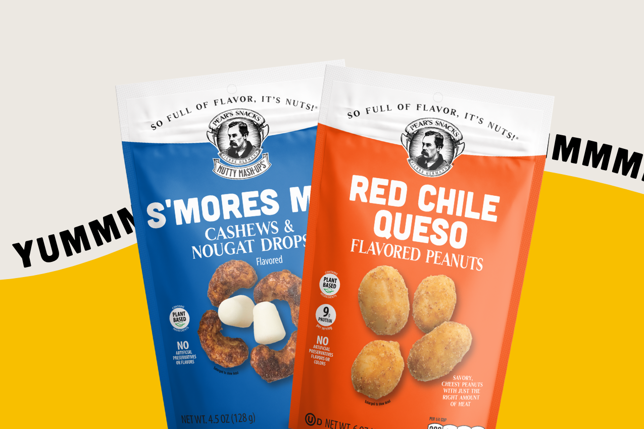 Two packages of Pear's Snacks, one S'mores, and one Red Chile Queso with yellow wave and the word YUMMMM all behind